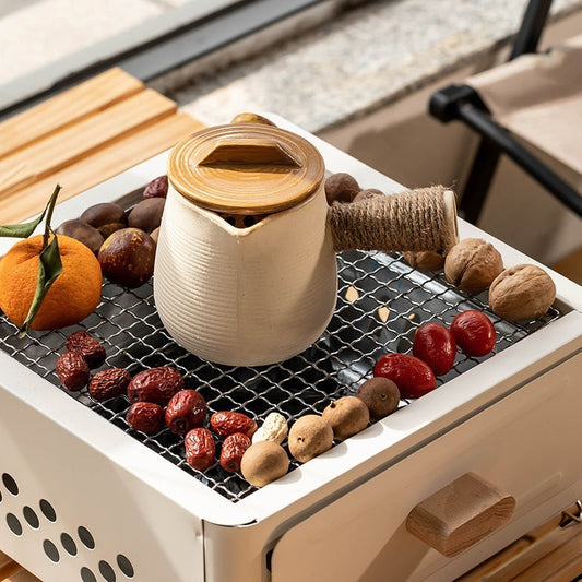 “Indoor BBQ box with grilling accessories and non-stick surface, perfect for cooking delicious meals indoors year-round, offering a smoke-free experience.”