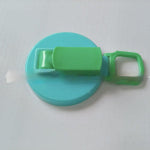 Green and blue plastic tool on a white background