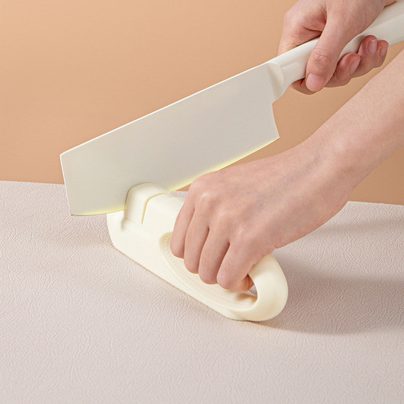 Manual kitchen knife sharpener with 2-section corundum design, perfect for household use. This beige sharpener ensures precision and durability for maintaining sharp knives. Ideal for everyday kitchen tasks, it restores the edge of your knives with ease, providing efficient and long-lasting sharpening. Everything Amazing Shop for this product.