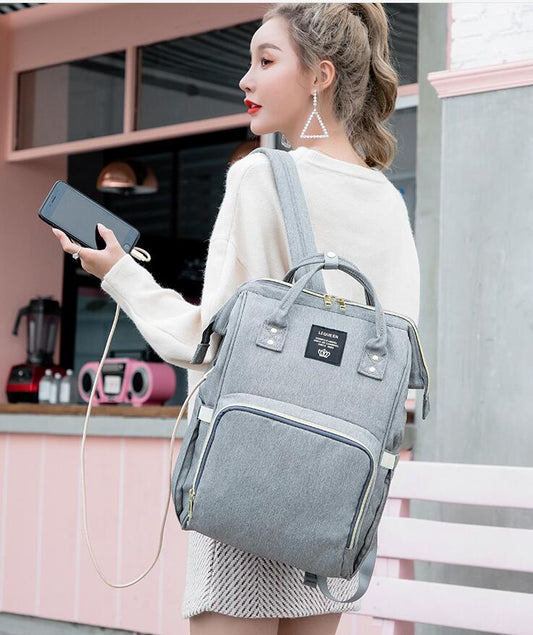 Stylish and practical Mummy Bag with USB Port and multi-functional design, perfect for moms on-the-go. Features spacious compartments, comfortable straps, and a built-in USB port for easy device charging. A must-have for new parents looking for convenience and style in their baby care essentials. Everything Amazing Shop for this product.