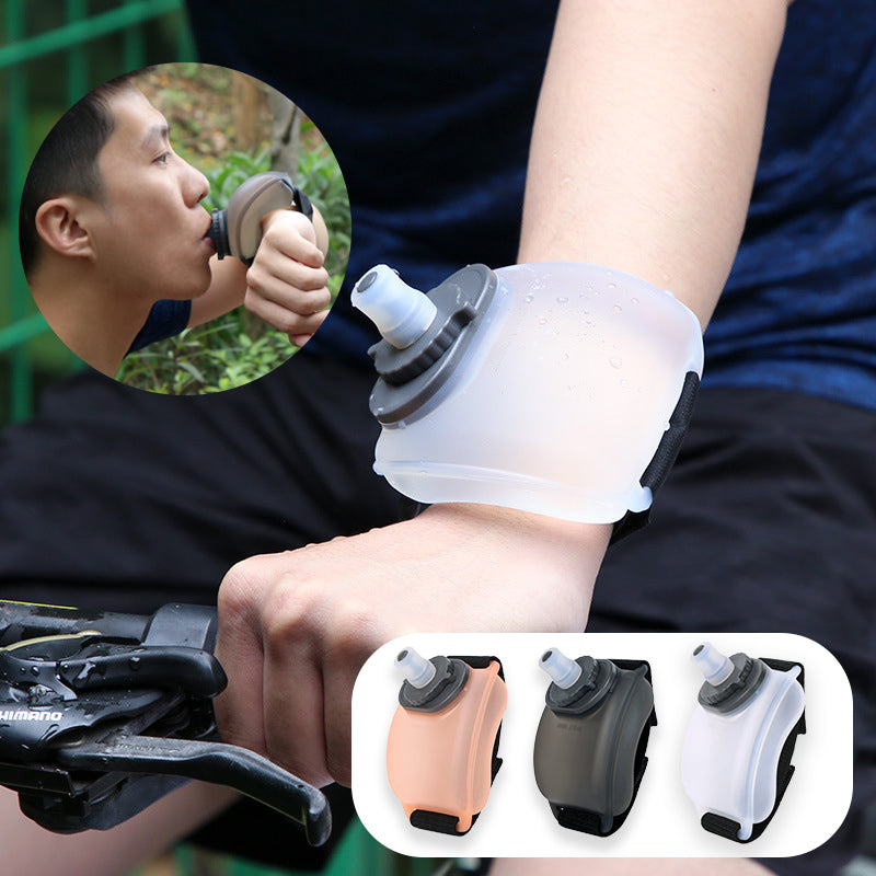 Portable wrist water bottle designed for hands-free hydration during running, cycling, and fitness activities. This 200ml sports bottle wraps comfortably around your wrist, providing easy access to water without interrupting your workout. Ideal for active individuals, it ensures you stay hydrated while engaging in sports and outdoor activities. Convenient, lightweight, and ergonomic, this portable water bottle is a must-have for fitness enthusiasts. Perfect for workouts, gym sessions, or outdoor adventures.