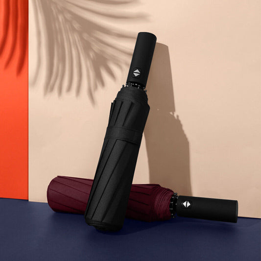 Black and burgundy umbrellas on a colorful background