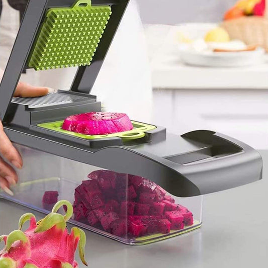 Vegetable chopper with dragon fruit being chopped on a kitchen counter.