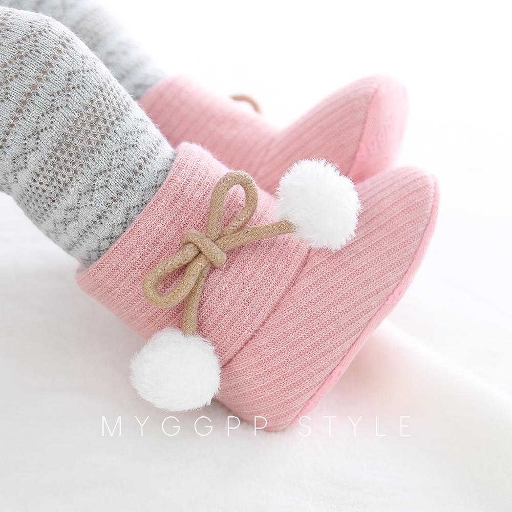 Baby boots in rustic setting