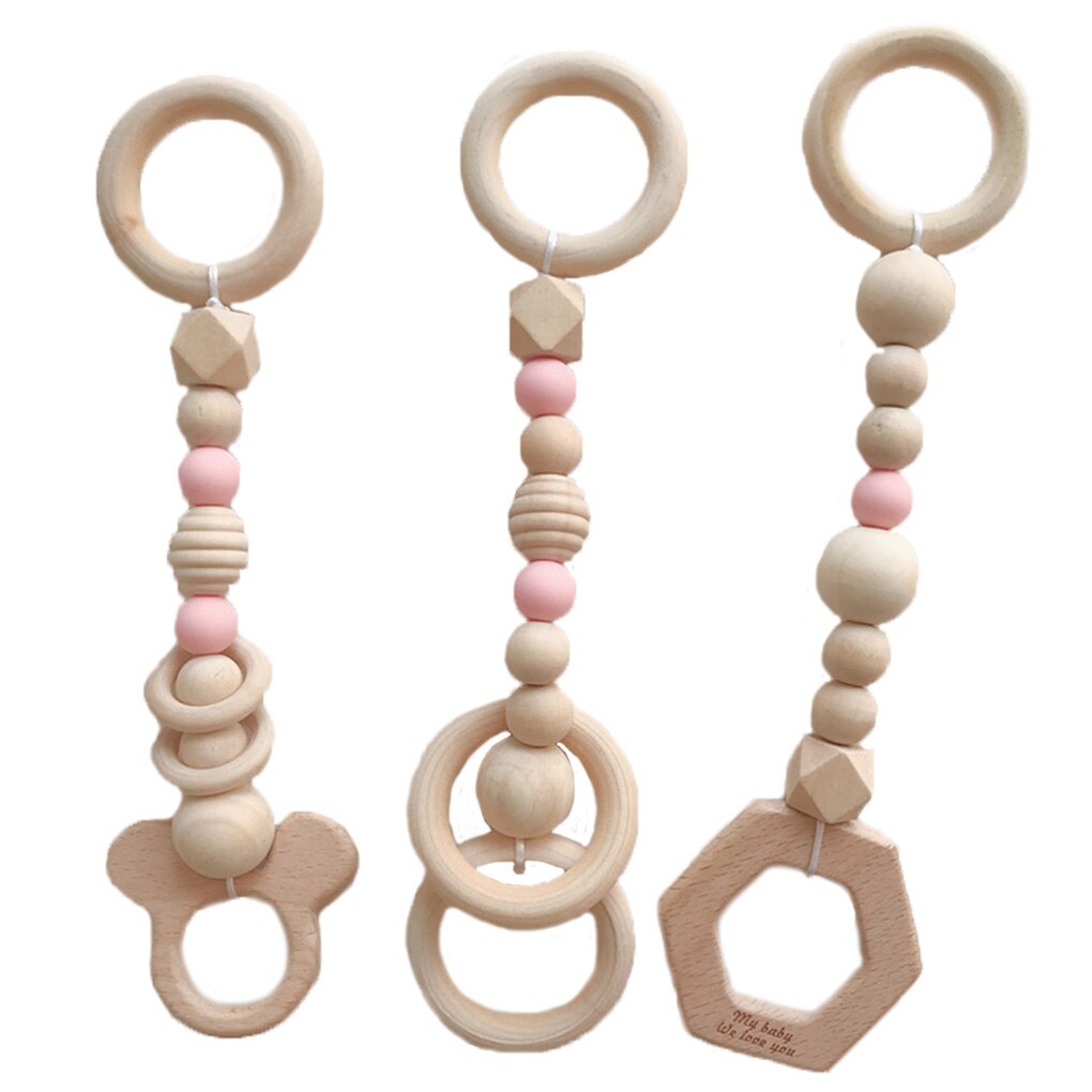 Baby grasping wooden teether