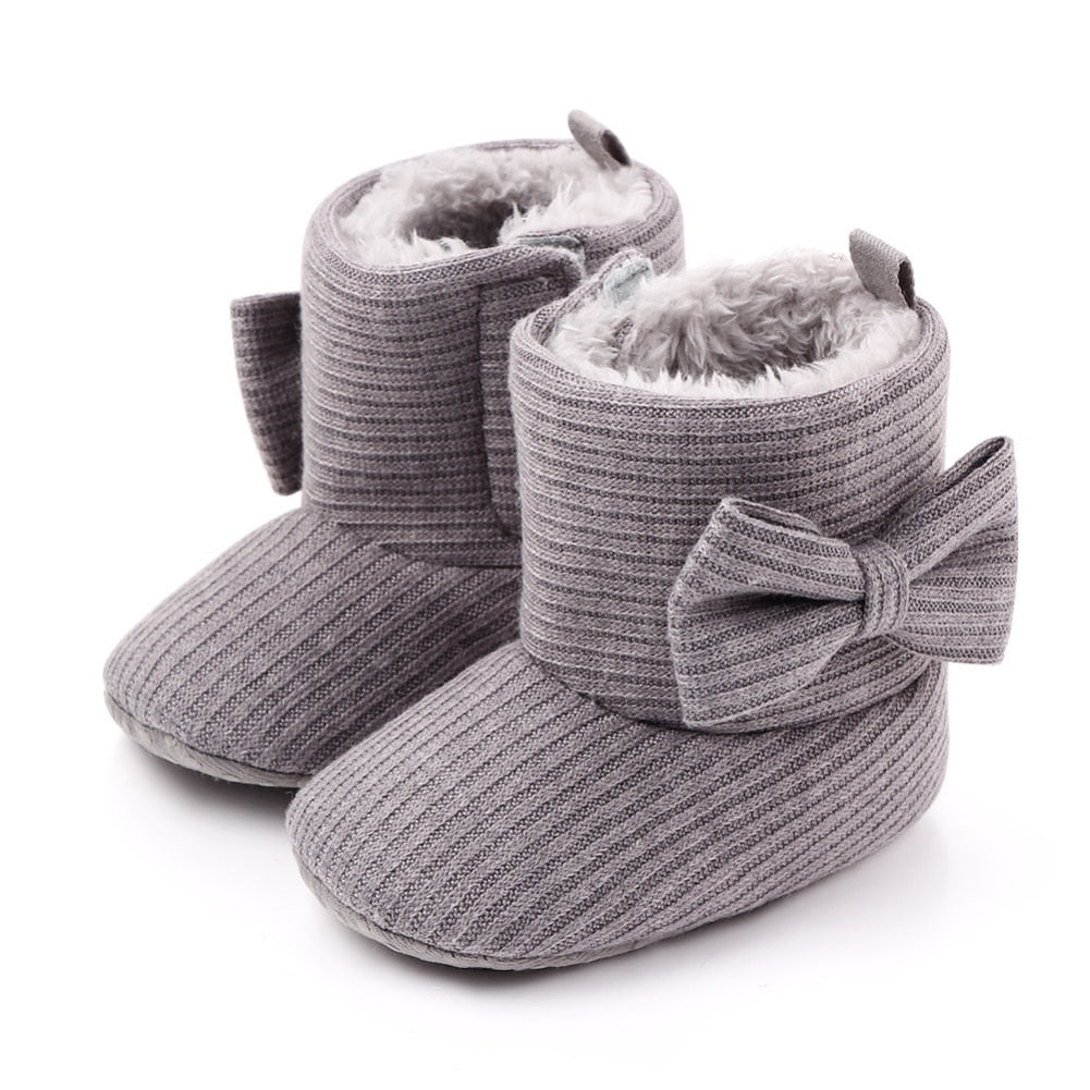 Baby boots in autumn setting