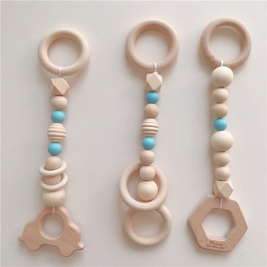 Baby chewing wooden teether