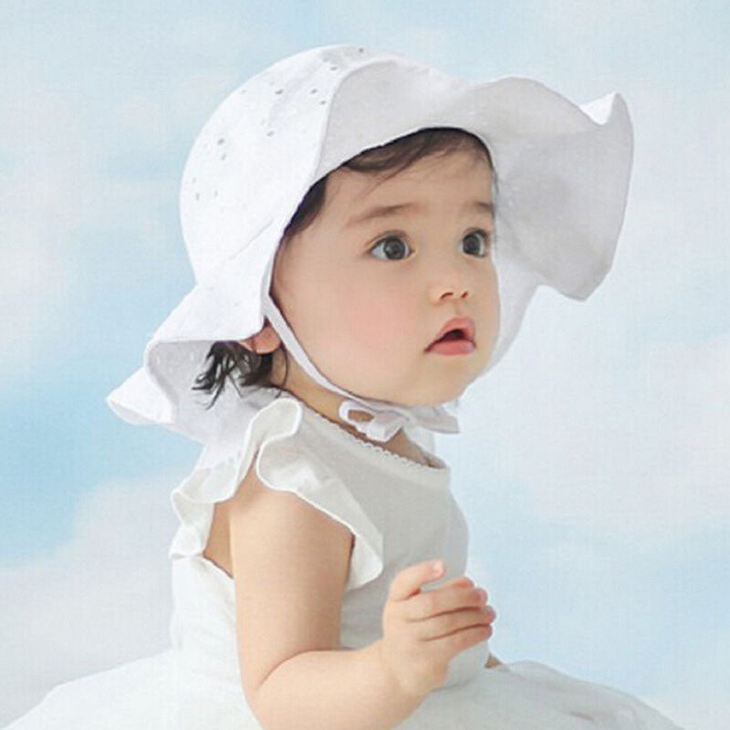 White baby sun hat with bow detail