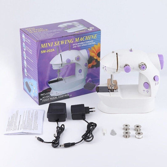 Mini sewing machine with packaging, accessories, and manuals on a white background