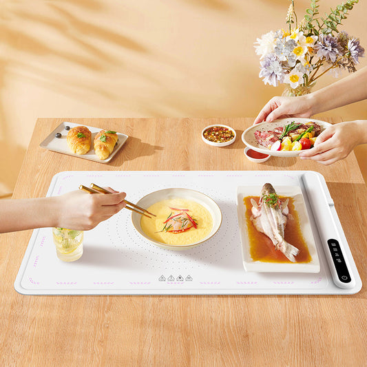 A high-quality Multi-Functional Intelligent Heat Preservation Silicone Mat designed for household use. This innovative warming plate is perfect for keeping food warm, protecting surfaces from heat damage, and adding a modern touch to your kitchen. Its silicone material is durable, non-slip, and easy to clean, making it ideal for everyday use. This versatile mat is an essential kitchen accessory for those who value convenience and functionality. Everything Amazing Shop for this product.