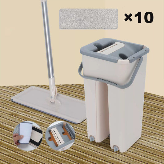 Mop and bucket set with additional cloths on a wooden floor background