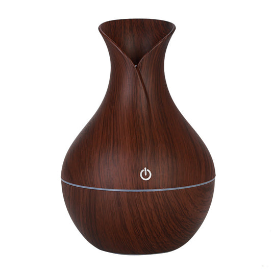 Vase Humidifier – 130ML Ultrasonic Aroma Diffuser with 40ML/H Atomization. This sleek and elegant ultrasonic aroma diffuser helps purify the air while adding a refreshing fragrance to your home or office. Ideal for creating a relaxing atmosphere, it features a 130ML water capacity and delivers a consistent 40ML/H atomization rate. Enhance your space with soothing scents and improved air quality with this stylish diffuser. Available now at Everything Amazing Shop.